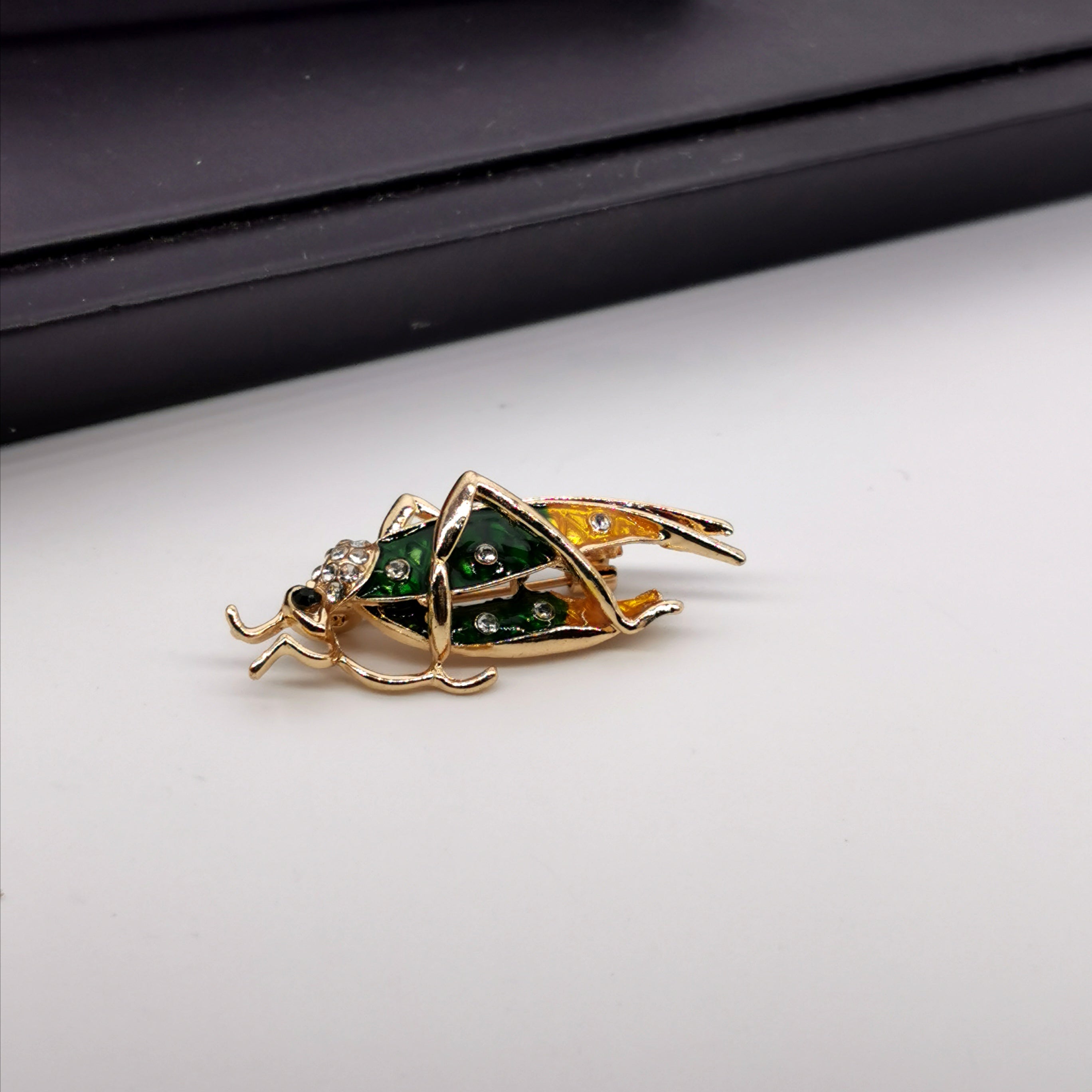 Grasshopper insert brooch
