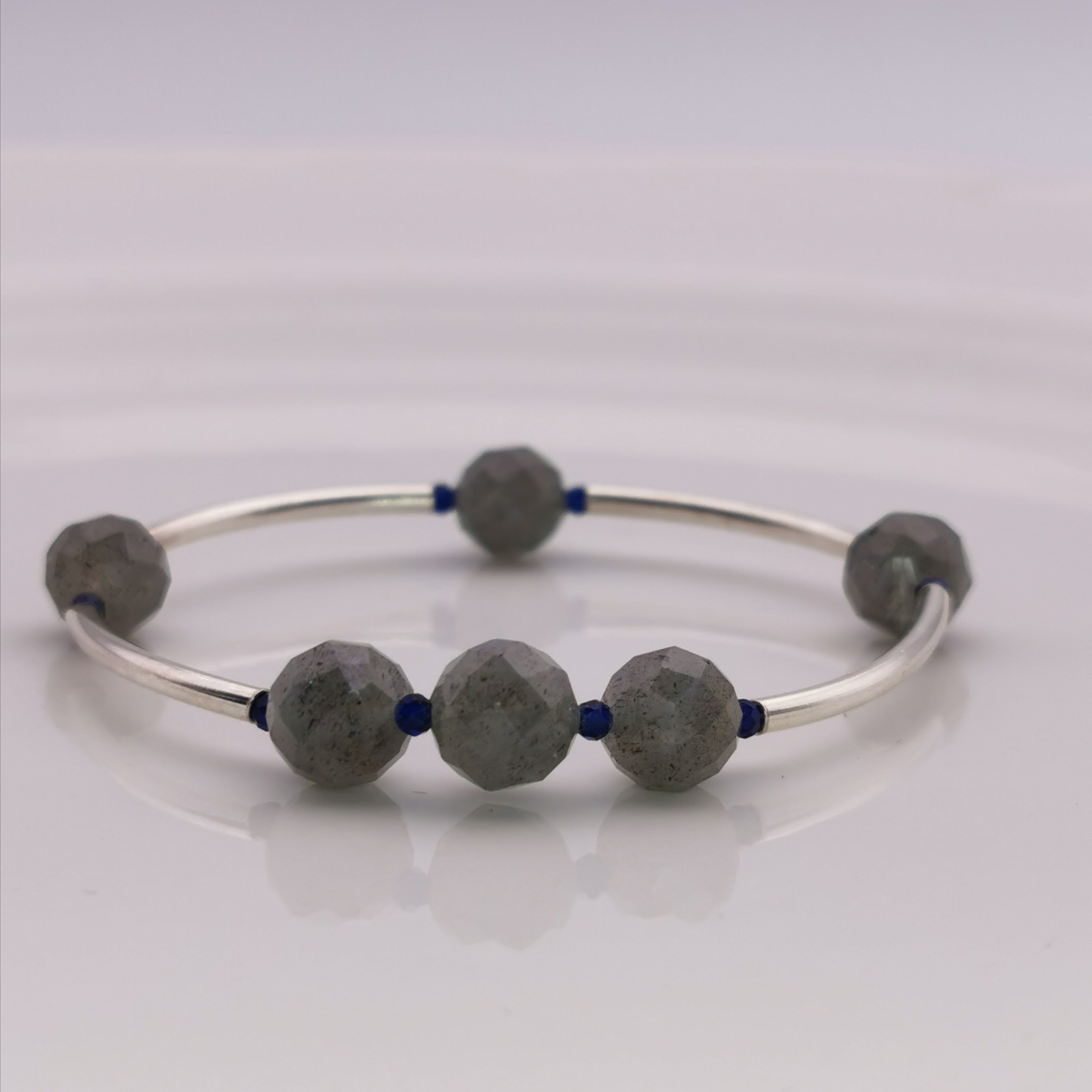 Handmde labradorite sterling silver tube with man made sapphire strech bracelet